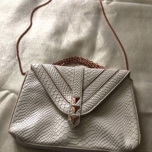 BCBGeneration cream snake print clutch